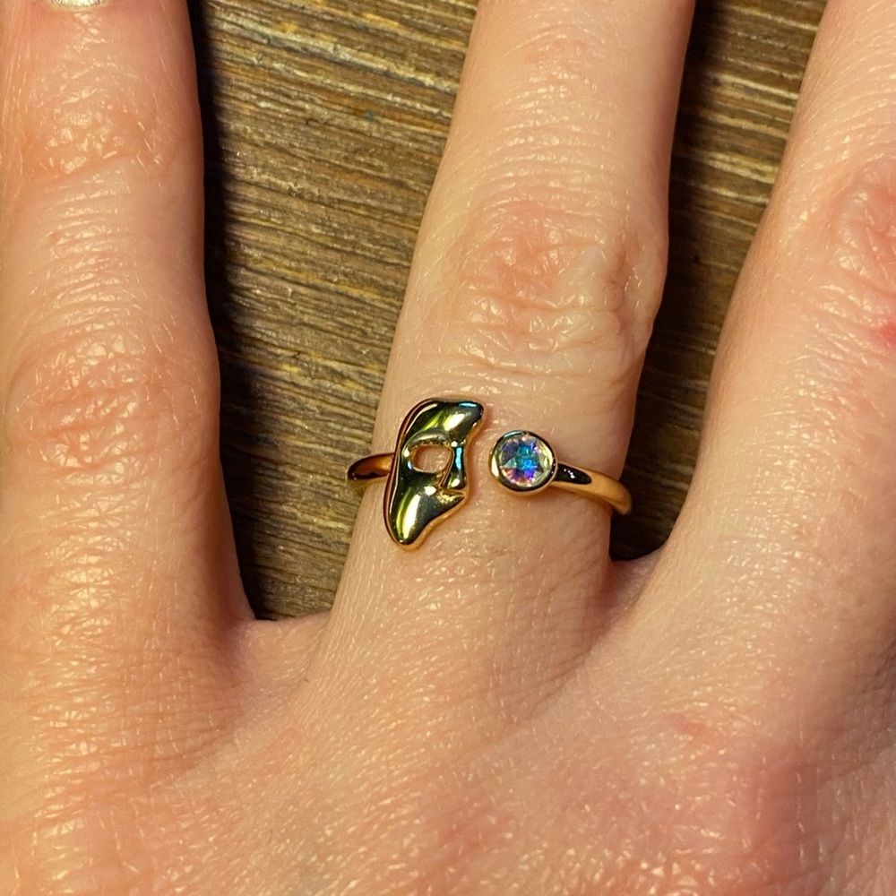 Gold masquerade mask ring with gem